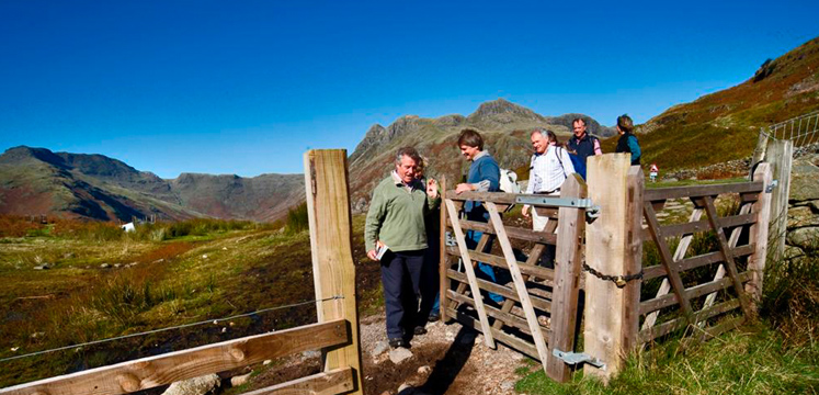 Walkers opening gate in the Langdale valley copyright Charlie Hedley