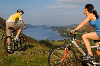 A couple cycling in the Lake District