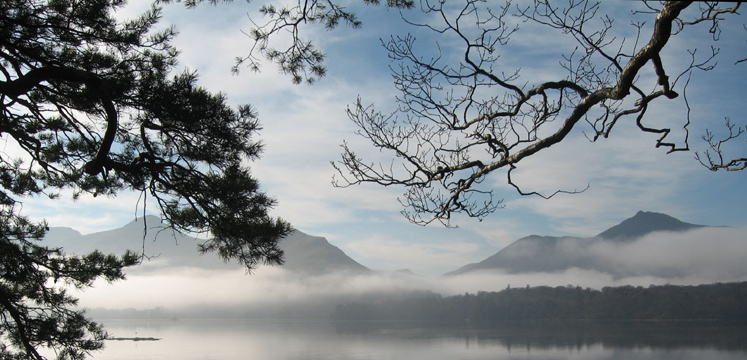 Catbells above Derwentwater through trees and mist copyright Helen Reynolds