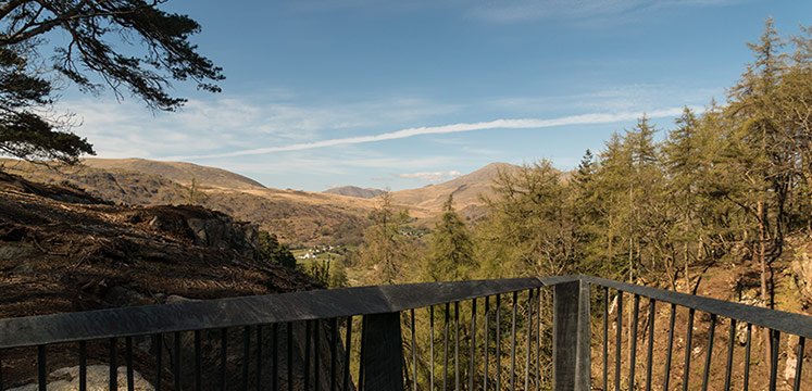 A metalwork platform jutting out over a steep sided ghyll.