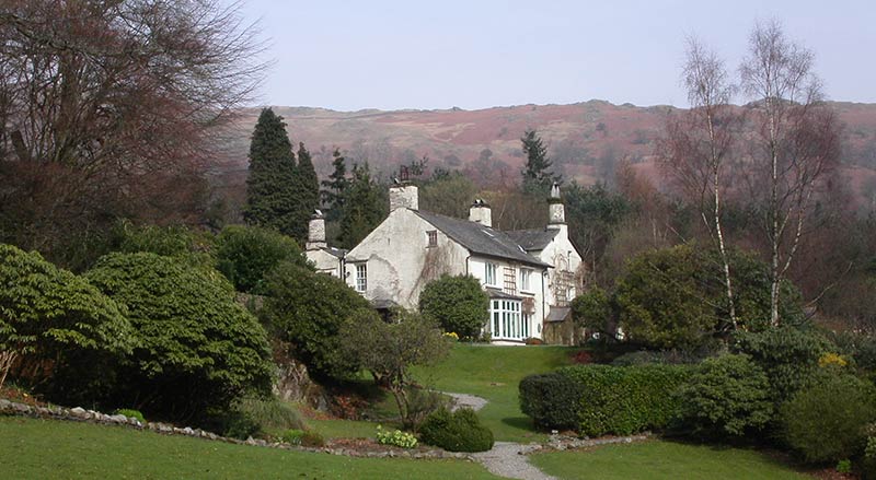 Rydal Mount and gardens with fells in the distance
