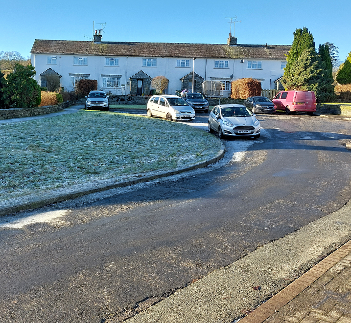 photo of cars parked outside houses to depict on-street parking. Hawkshead