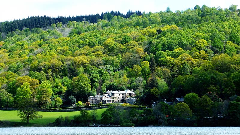 Brantwood house amongst woodland on the shore of Coniston Water