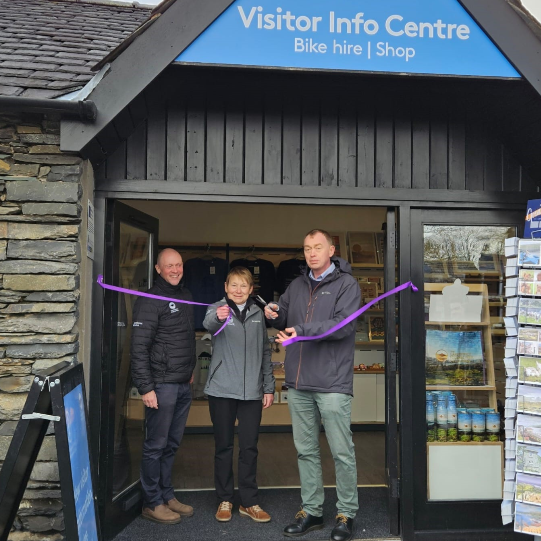 Richard Leafe, Chief Executive of the Lake District National Park Authority (left) Tiffany Hunt, Lake District National Park Authority Chair (middle) and Tim Farron, local MP (right) Smiling and cutting the ribbon.