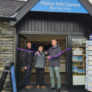 Richard Leafe, Chief Executive of the Lake District National Park Authority (left) Tiffany Hunt, Lake District National Park Authority Chair (middle) and Tim Farron, local MP (right) Smiling and cutting the ribbon.