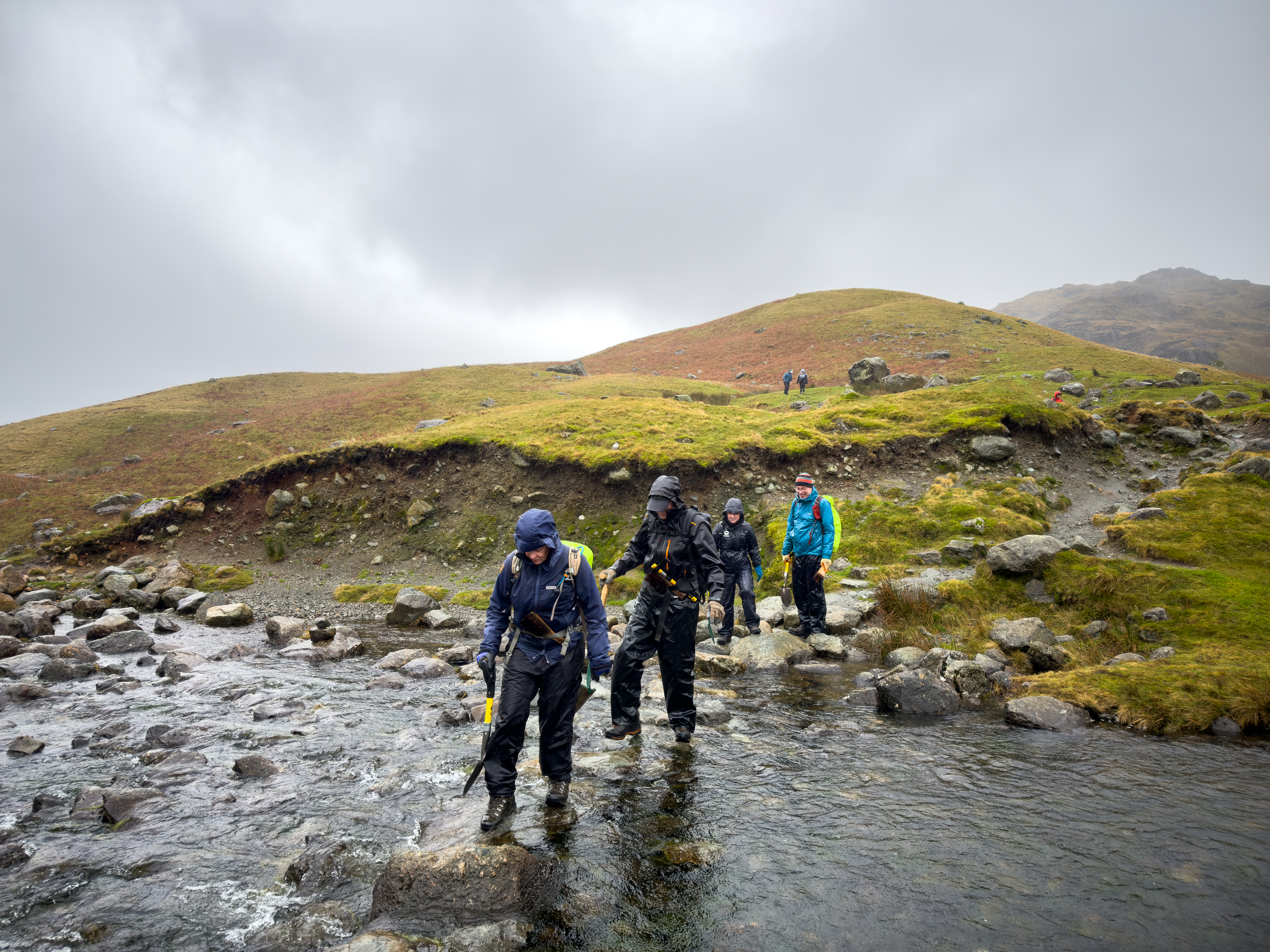 Volunteers work on a path at Easedale Tarn in the Lake District