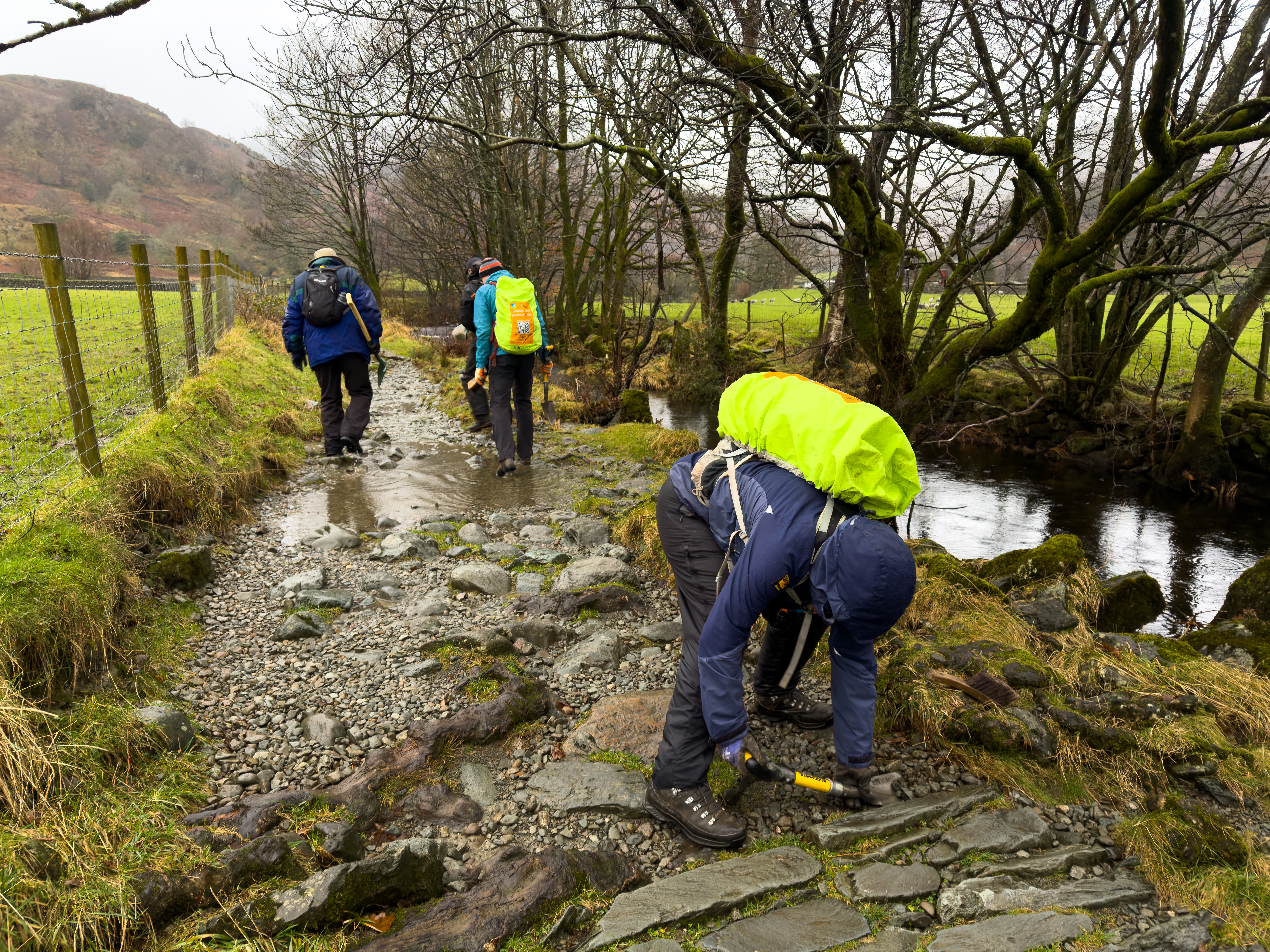 Volunteers work on a path at Easedale Tarn in the Lake District