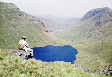 Taking in the view above Grisedale Tarn