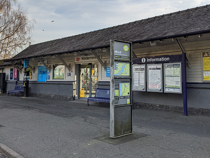 An information panel and map outside Windermere Railway Station.