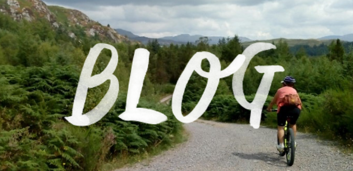 Connie on her ebike with beautiful West Cumbria scenery