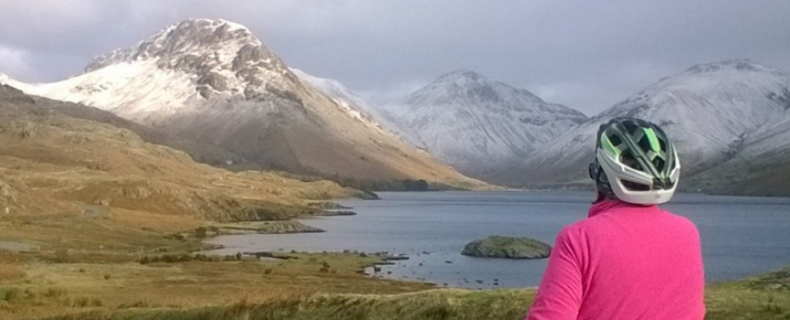 Connie looking out from her ebike over a snowy West Cumbrian scene