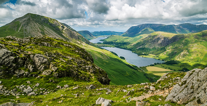 View down a valley with Buttermere lake