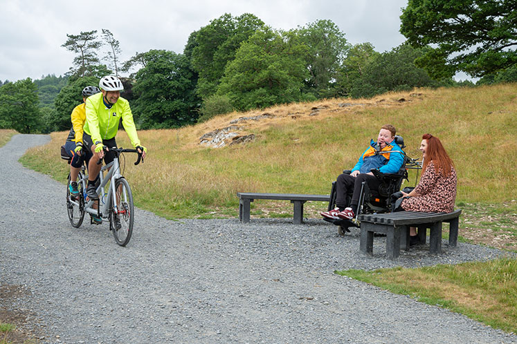 Cyclists and Wheelchair User enjoying the accessible route - West Windermere Way