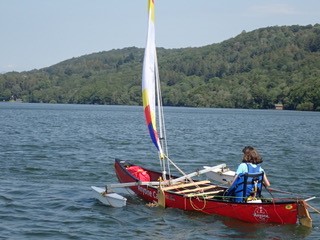 Woman canoeing using an accessible seat, 
